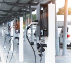 Electric car on electric car charging station. Power supply for electric car charging. Clean energy concept