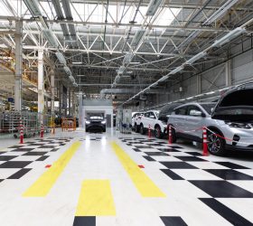 Modern car assembly plant. Auto industry. Interior of a high-tech factory, modern production of automobiles.